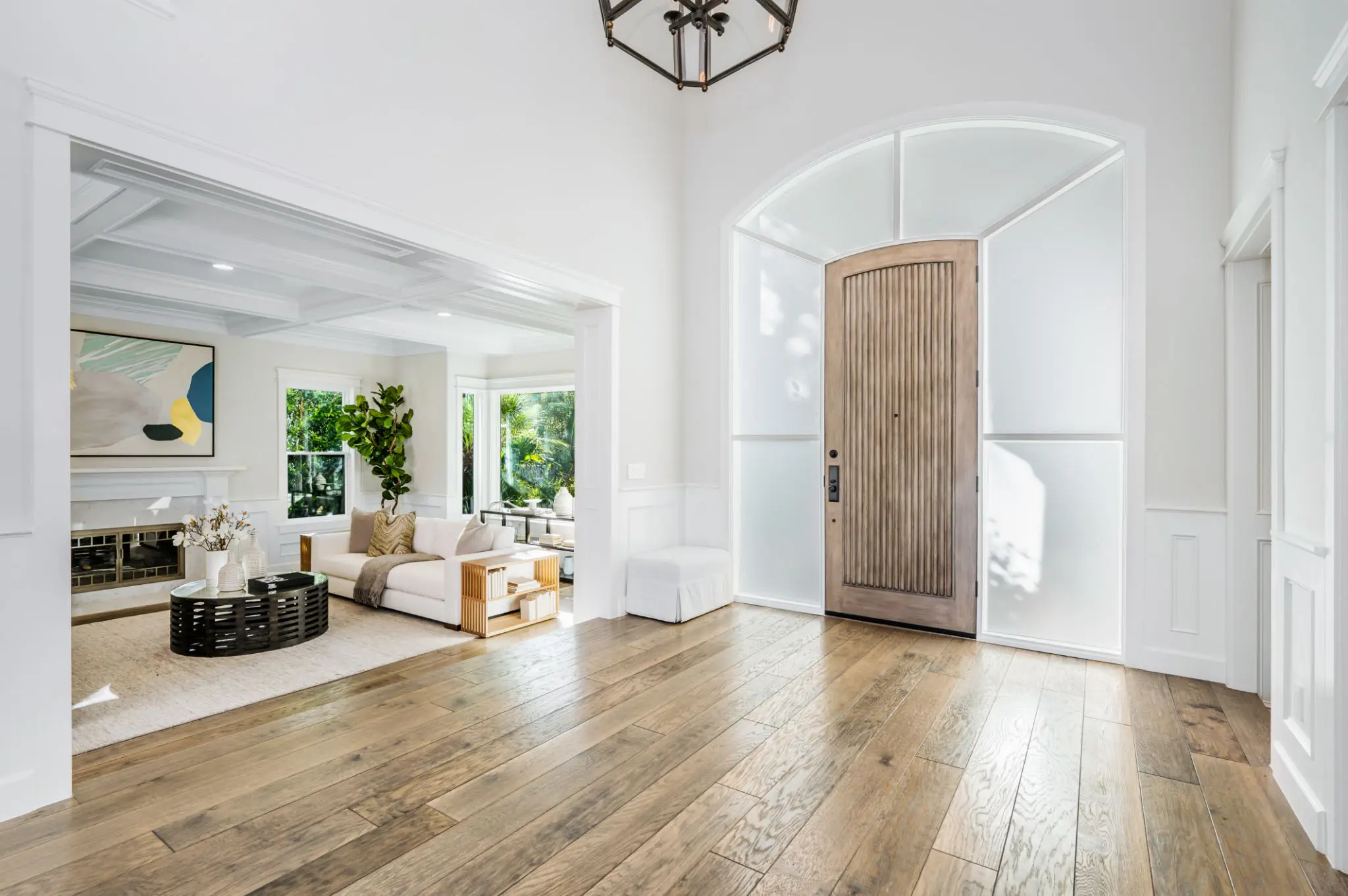 Bright entryway with wooden floor and decor.